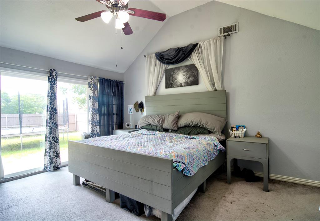 4825 Bobtown Road Garland, TX 75043 - Photo 9 of 17 a bedroom with a bed and a window