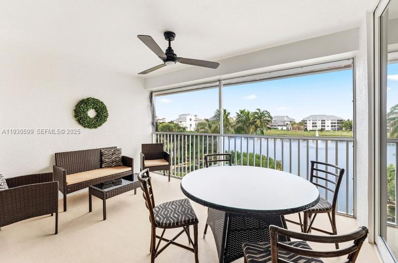 353 Highway 1, Unit C404 Jupiter, FL 33477 - Photo 2 of 30 a view of a livingroom with furniture window and wooden floor
