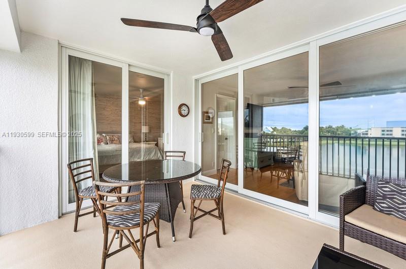353 Highway 1, Unit C404 Jupiter, FL 33477 - Photo 22 of 30 a dining room with furniture and front door