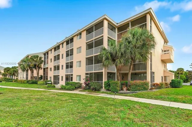 a view of a lake with a house in the background