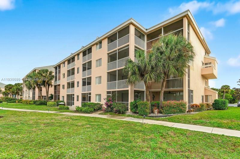 353 Highway 1, Unit C404 Jupiter, FL 33477 - Photo 24 of 30 a front view of building with yard