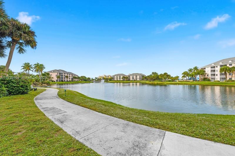353 Highway 1, Unit C404 Jupiter, FL 33477 - Photo 27 of 30 a view of a lake with houses in the back