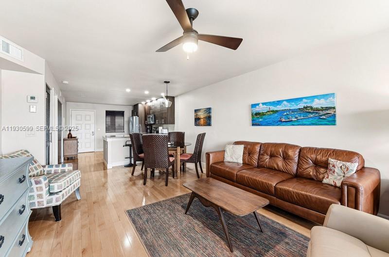 353 Highway 1, Unit C404 Jupiter, FL 33477 - Photo 5 of 30 a living room with furniture kitchen view and a dining table