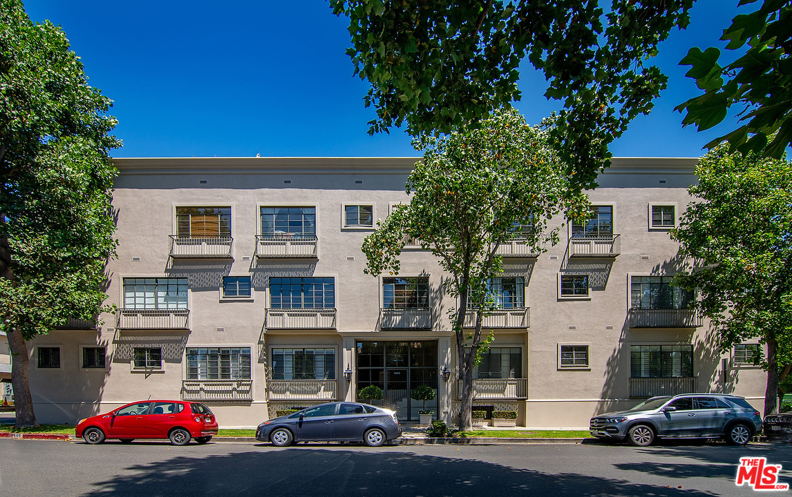 9601 Charleville Boulevard, Unit 8 Beverly Hills, CA 90212 - Photo 2 of 47 a front view of a building with street view
