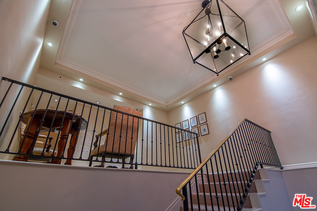 9601 Charleville Boulevard, Unit 8 Beverly Hills, CA 90212 - Photo 15 of 47 a view of staircase with rug floor