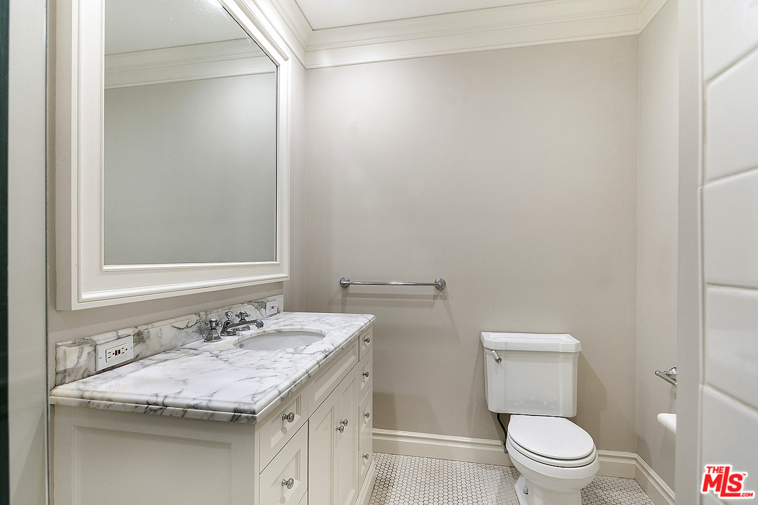 9601 Charleville Boulevard, Unit 8 Beverly Hills, CA 90212 - Photo 39 of 47 a bathroom with a sink and a toilet