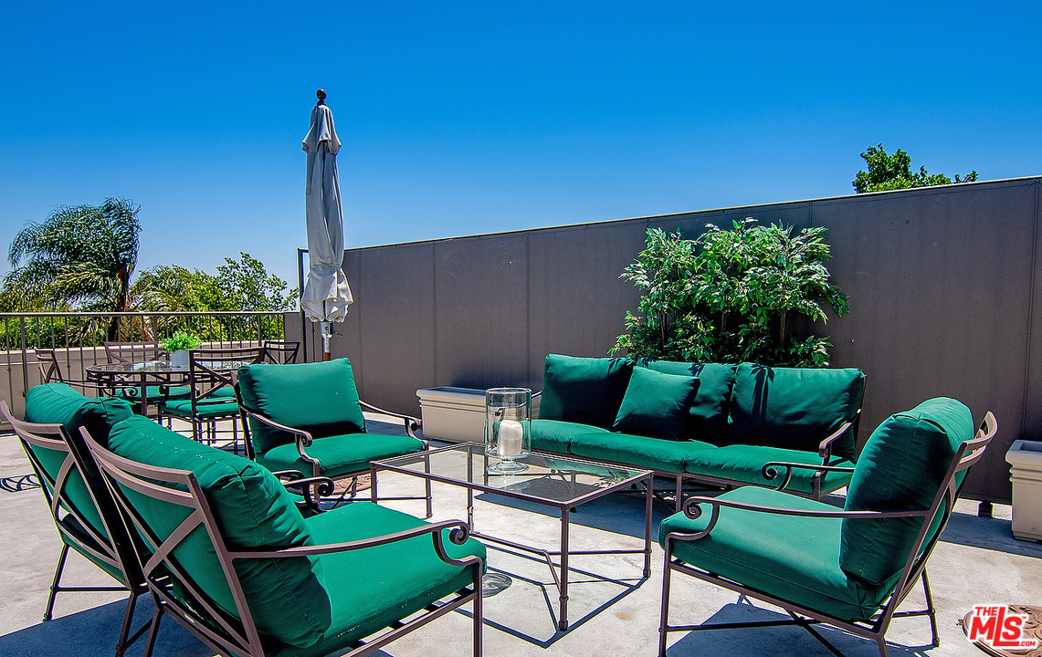 9601 Charleville Boulevard, Unit 8 Beverly Hills, CA 90212 - Photo 46 of 47 a view of a chairs in patio