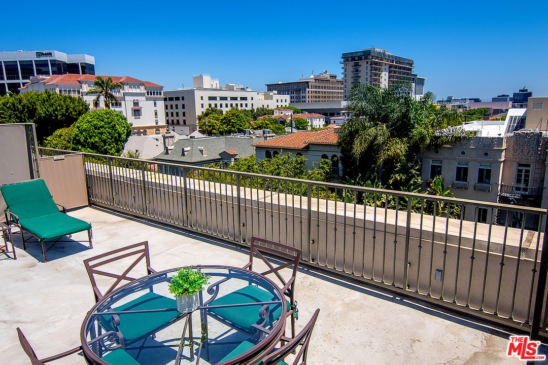 9601 Charleville Boulevard, Unit 8 Beverly Hills, CA 90212 - Photo 47 of 47 a view of a balcony with wooden floor