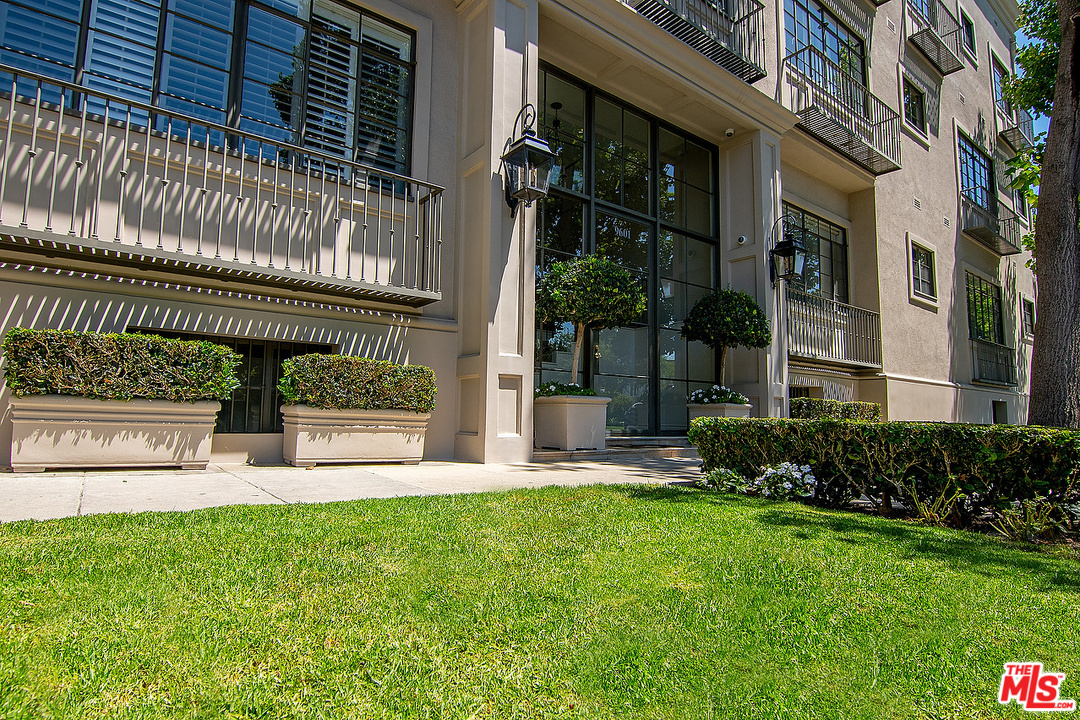 9601 Charleville Boulevard, Unit 8 Beverly Hills, CA 90212 - Photo 9 of 47 a view of a house with a yard and plants