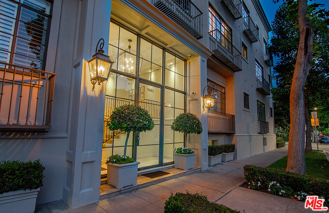 9601 Charleville Boulevard, Unit 8 Beverly Hills, CA 90212 - Photo 10 of 47 a view of a building with a potted plant and a large window