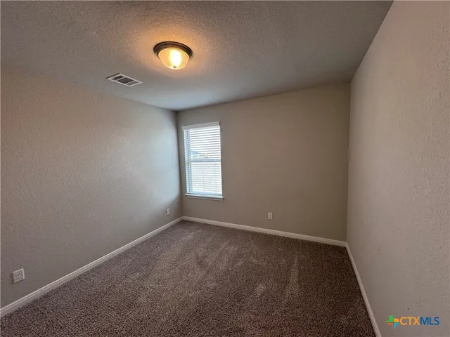 a view of a room with window and stairs