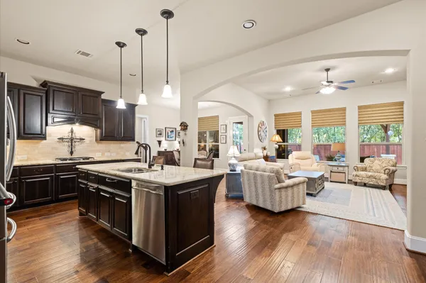 a kitchen with living room and living room view