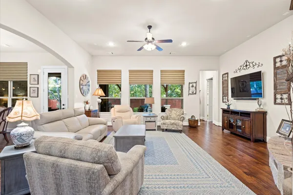 a living room with fireplace furniture and a flat screen tv