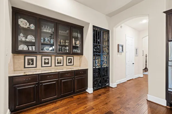 a view of a kitchen with stainless steel appliances granite countertop a stove and a sink