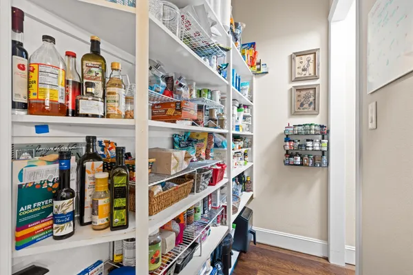 a view of water heater room with shelves
