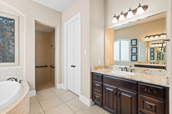 a bathroom with a sink double vanity and a mirror