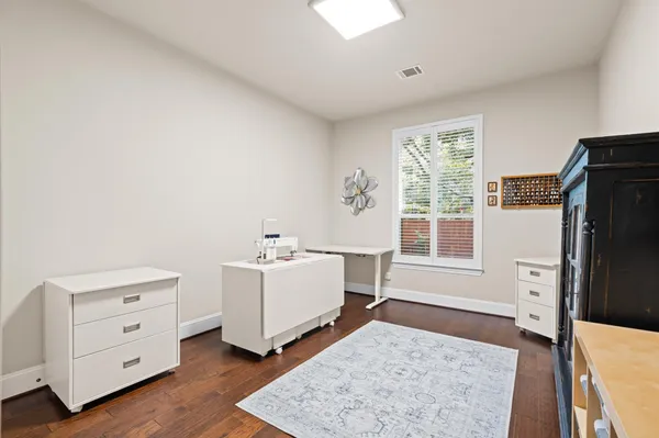 a room with a dresser and a window