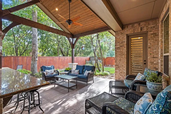 a backyard of a house with outdoor seating