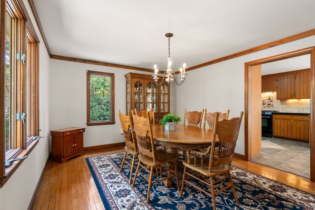 27 Stuart Road Rochester, MA 02770 - Photo 15 of 42 a view of a dining room with furniture window and wooden floor