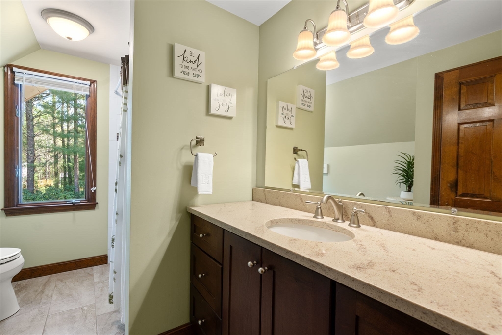 27 Stuart Road Rochester, MA 02770 - Photo 20 of 42 a bathroom with a granite countertop sink a large mirror and a shower