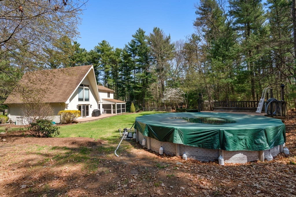 27 Stuart Road Rochester, MA 02770 - Photo 26 of 42 a view of a house with a yard and sitting area