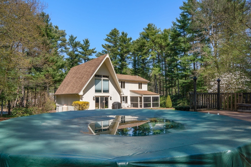 27 Stuart Road Rochester, MA 02770 - Photo 27 of 42 front view of house with a yard