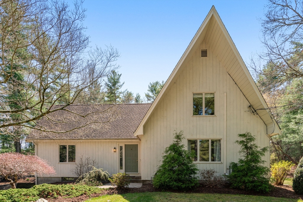 27 Stuart Road Rochester, MA 02770 - Photo 42 of 42 a view of a white house next to a yard with potted plants