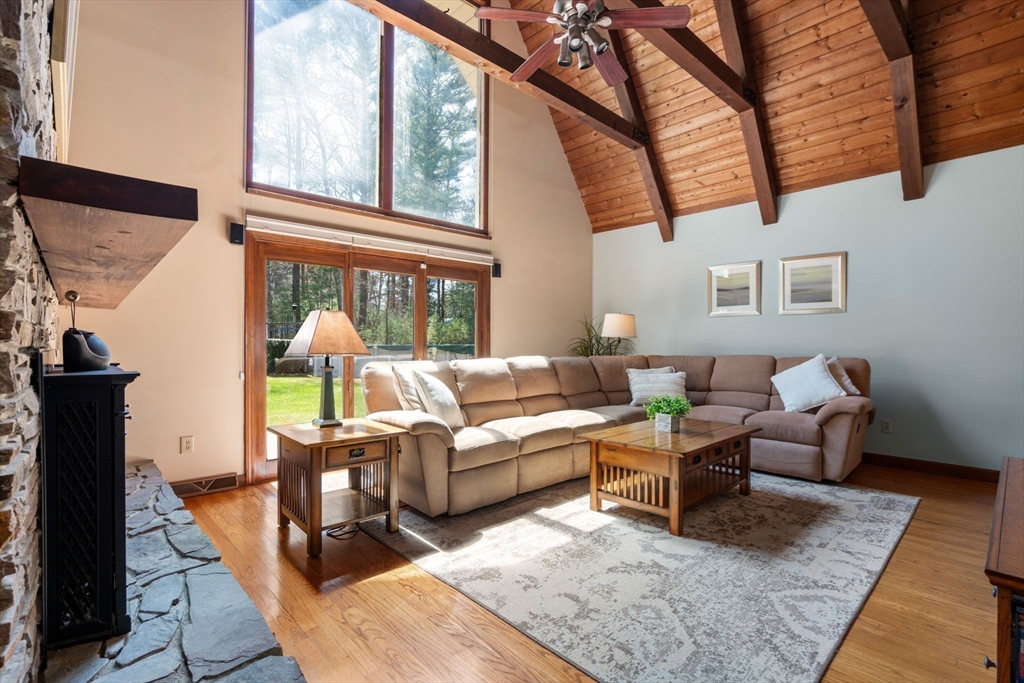 27 Stuart Road Rochester, MA 02770 - Photo 8 of 42 a living room with furniture wooden floor and a table