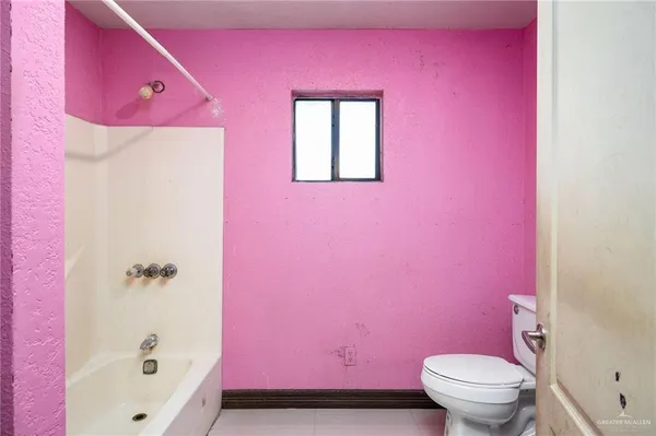 a bathroom with a bath tub