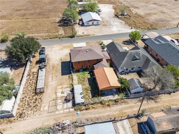 an aerial view of houses with outdoor space