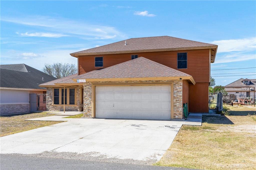 117 Hernandez Road Rio Grande City, TX 78582 - Photo 22 of 23 a front view of a house with a yard