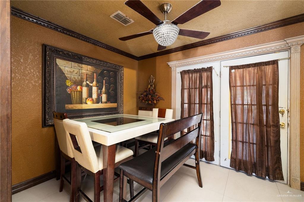 117 Hernandez Road Rio Grande City, TX 78582 - Photo 6 of 23 a view of a dining room with furniture window and wooden floor
