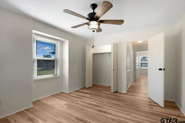 a bathroom with a toilet a sink and a mirror