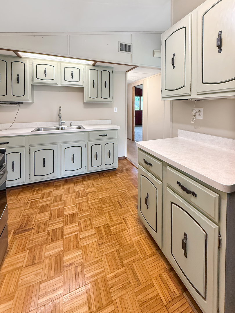 814 Pinecrest Drive Rantoul, IL 61866 - Photo 8 of 22 a kitchen with stainless steel appliances a sink and a cabinets