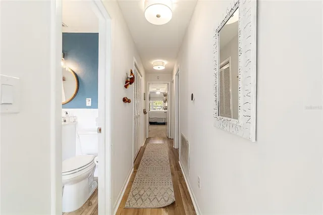 a view of a bathroom from a hallway