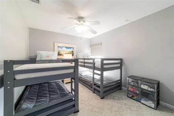 a bedroom with bed and a window