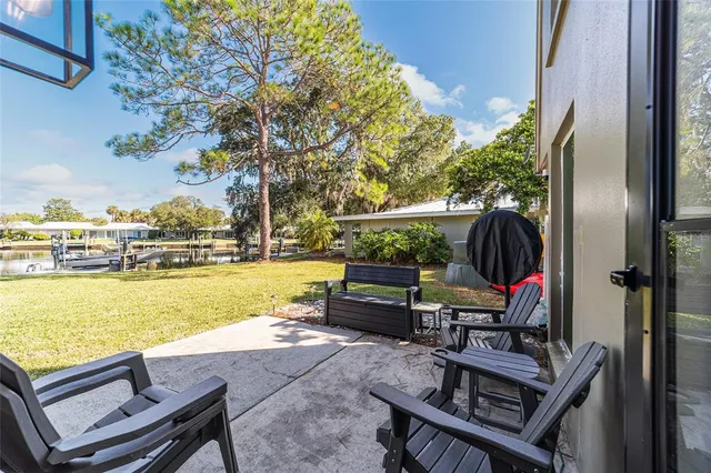 a view of swimming pool with outdoor seating and plants