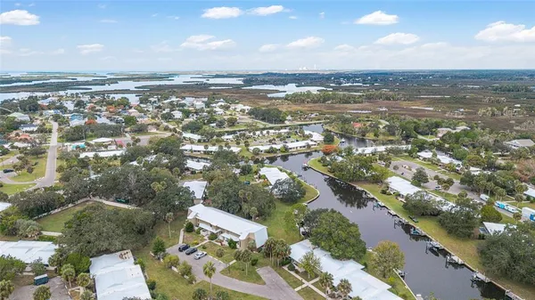 an aerial view of residential building and ocean view