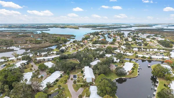 an aerial view of residential building and lake