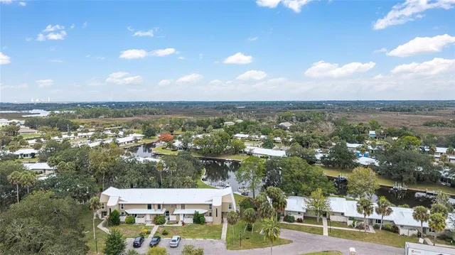 an aerial view of residential houses with city view