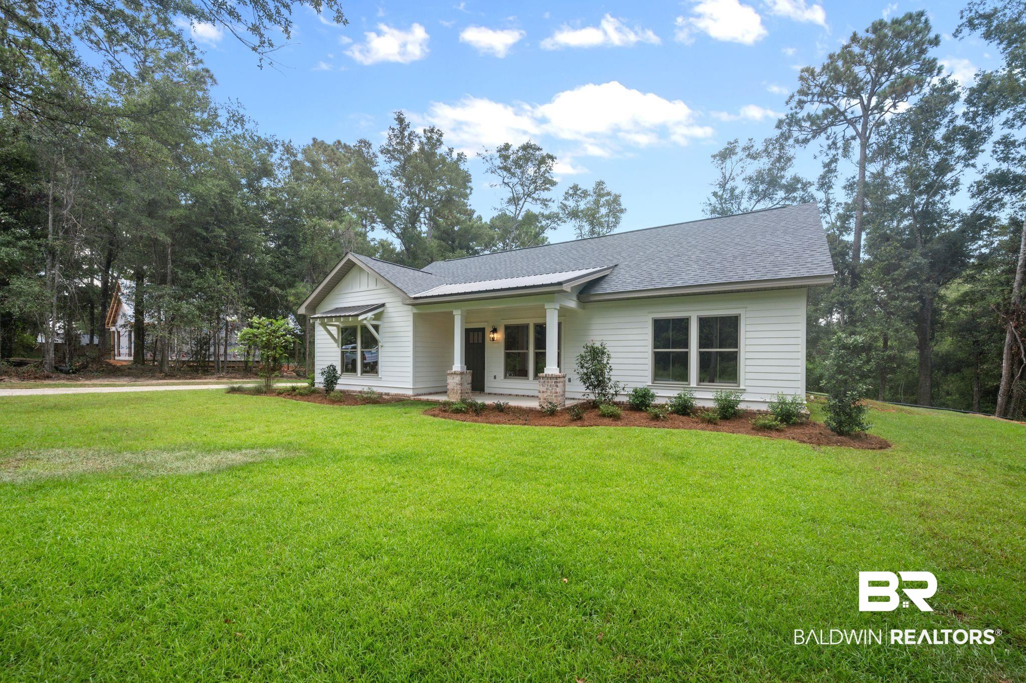 12412 Mannich Lane Foley, AL 36535 - Photo 2 of 23 Single story home with a front yard and a porch