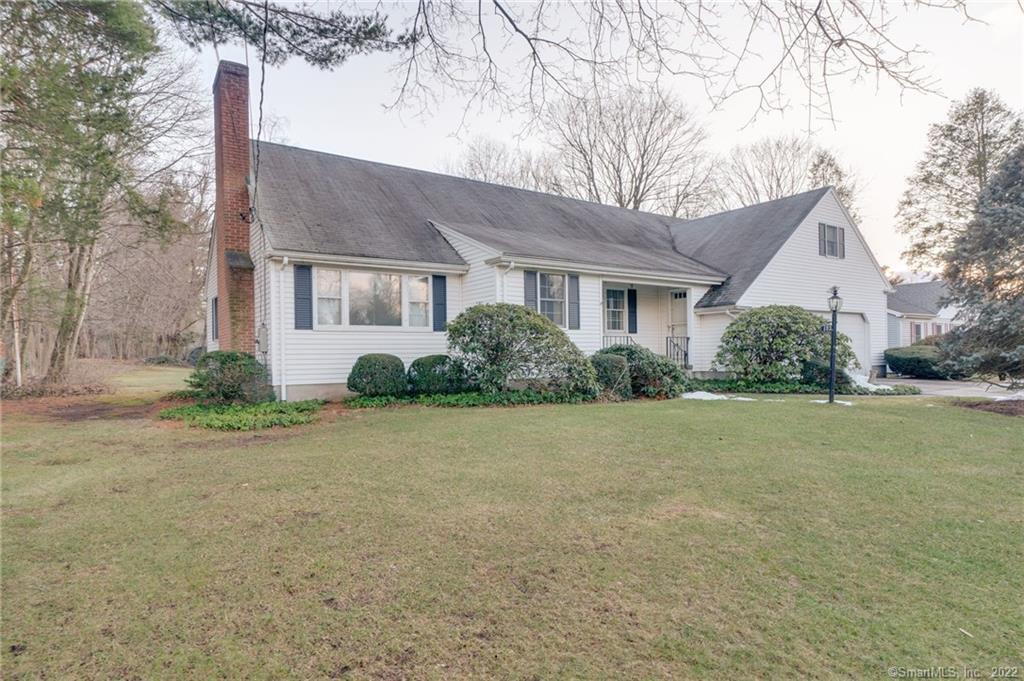Custom built modified New England Ranch/Cape situated on a beautiful almost 1/2 acre level lot