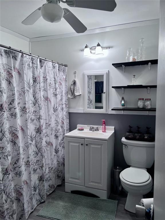 146 Canyon Pass Cleveland, GA 30528 - Photo 12 of 21 a bathroom with a sink a toilet and shower curtain
