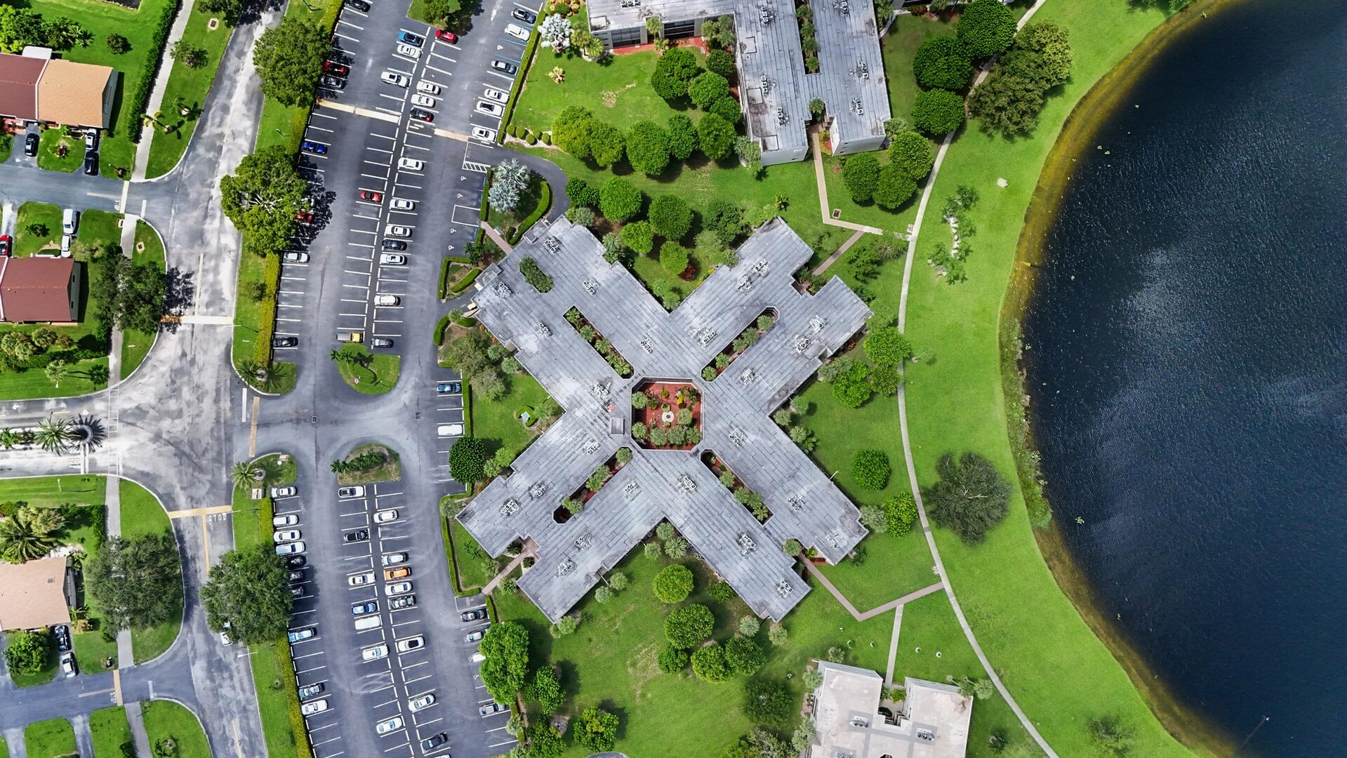 5310 Las Verdes Circle, Unit 118 Delray Beach, FL 33484 - Photo 17 of 20 an aerial view of a house with a garden and plants