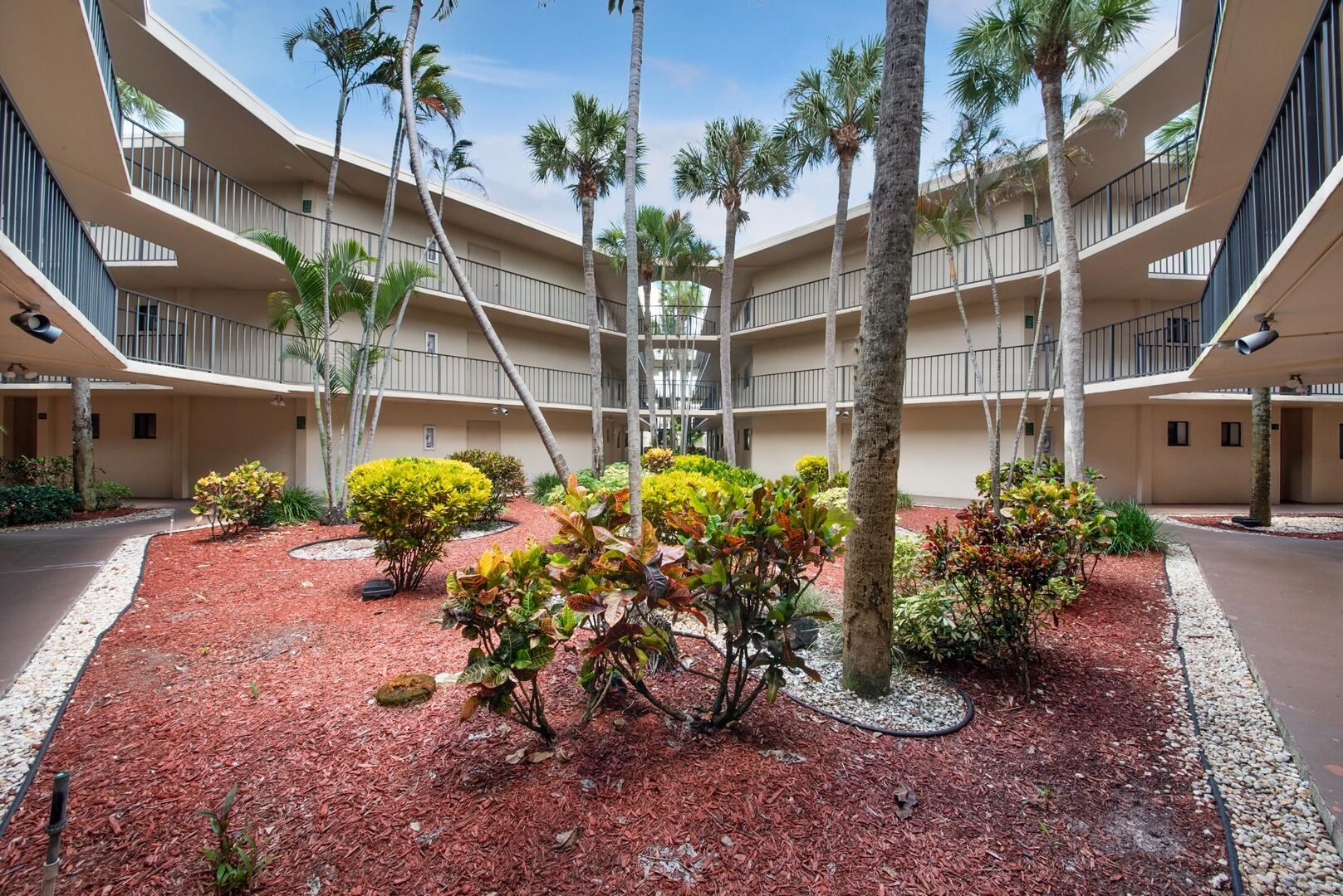 5310 Las Verdes Circle, Unit 118 Delray Beach, FL 33484 - Photo 19 of 20 a view of a garden with plants
