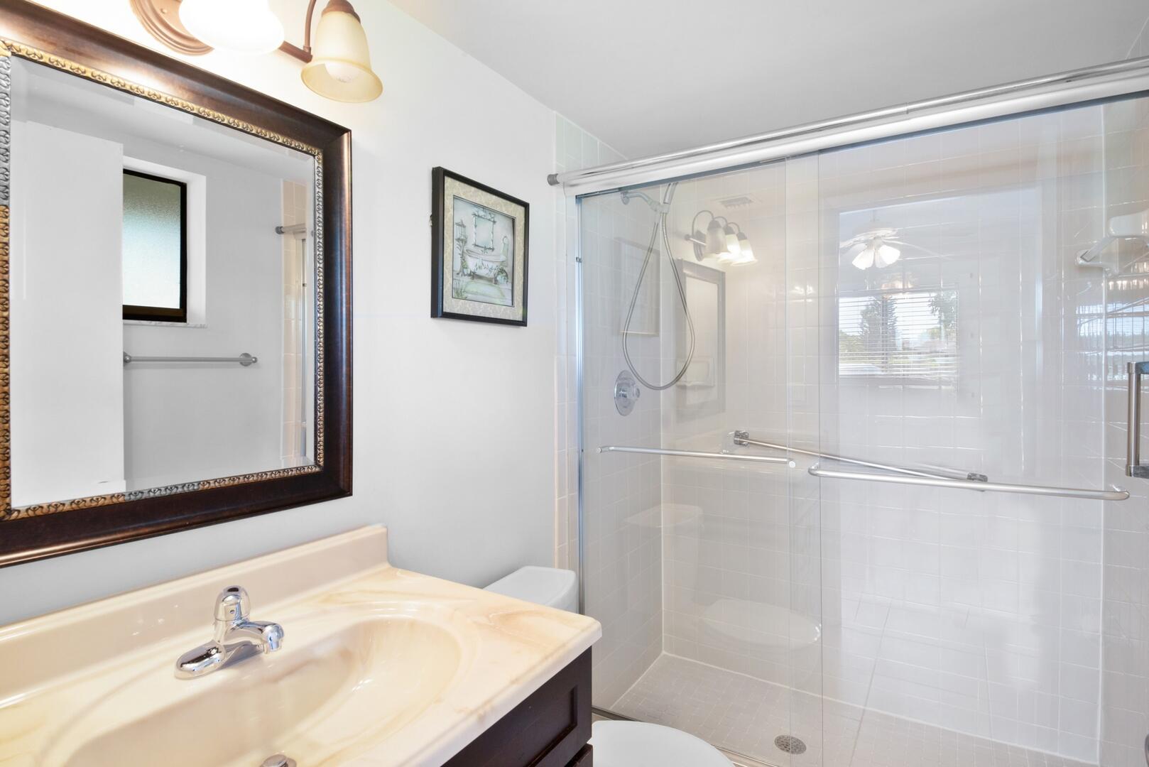 5310 Las Verdes Circle, Unit 118 Delray Beach, FL 33484 - Photo 9 of 20 a bathroom with a sink and a mirror