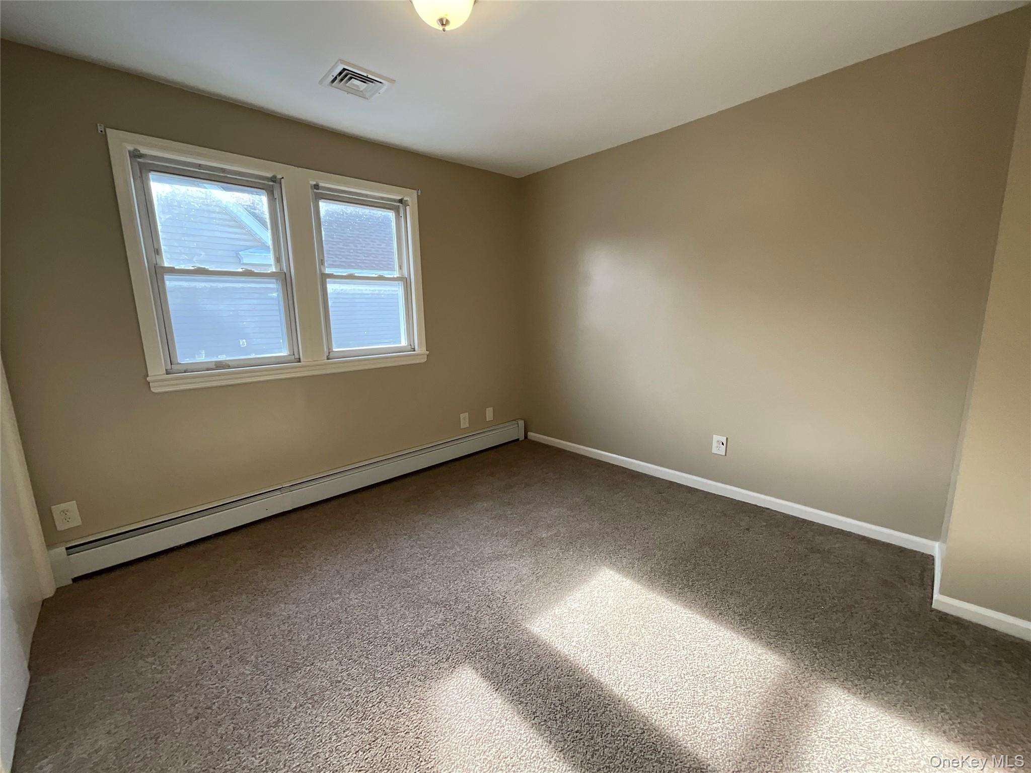 32 Prairie Avenue, Unit B Suffern, NY 10901 - Photo 18 of 26 an empty room with a window