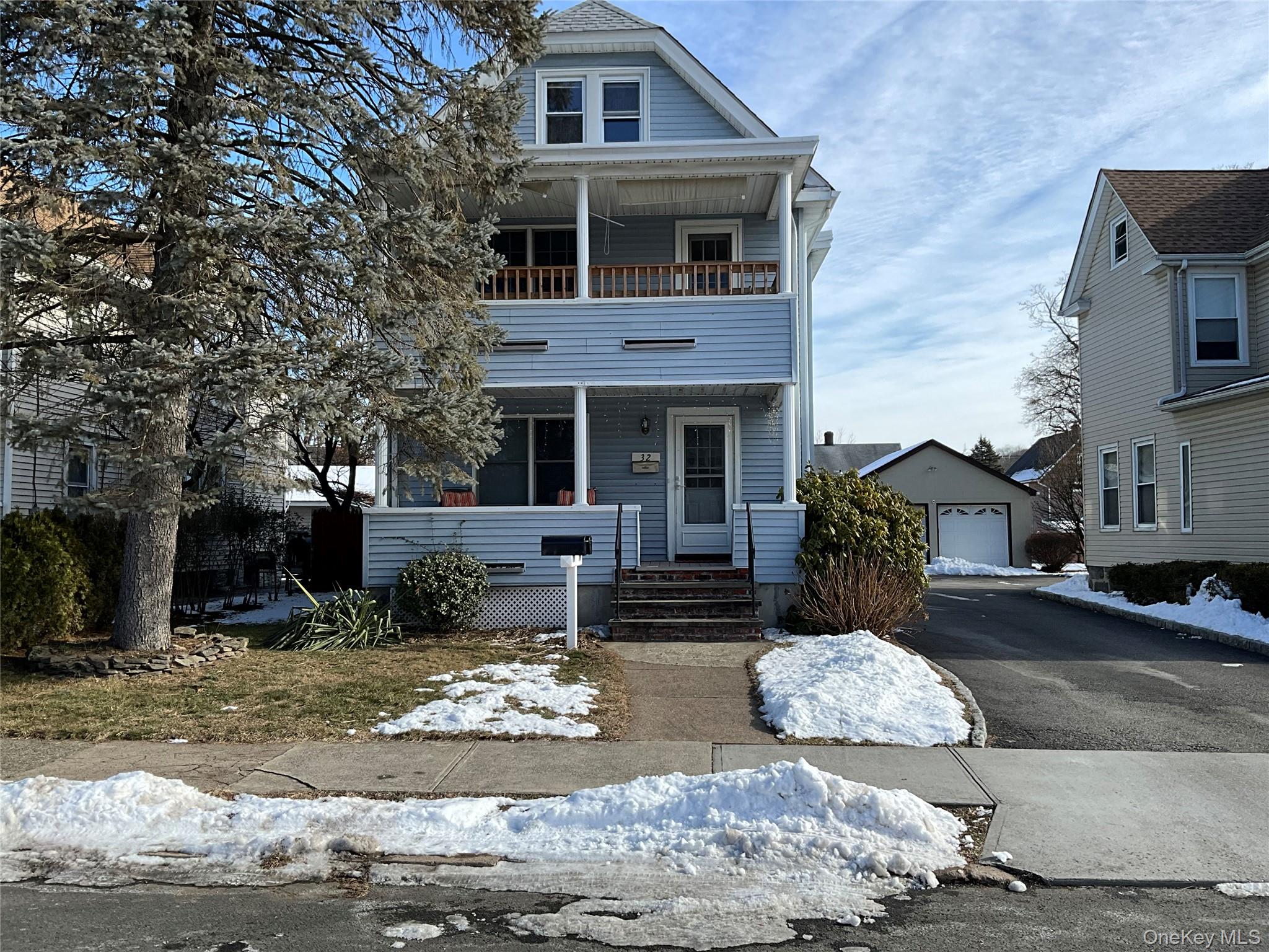 32 Prairie Avenue, Unit B Suffern, NY 10901 - Photo 2 of 26 a front view of a house with garden