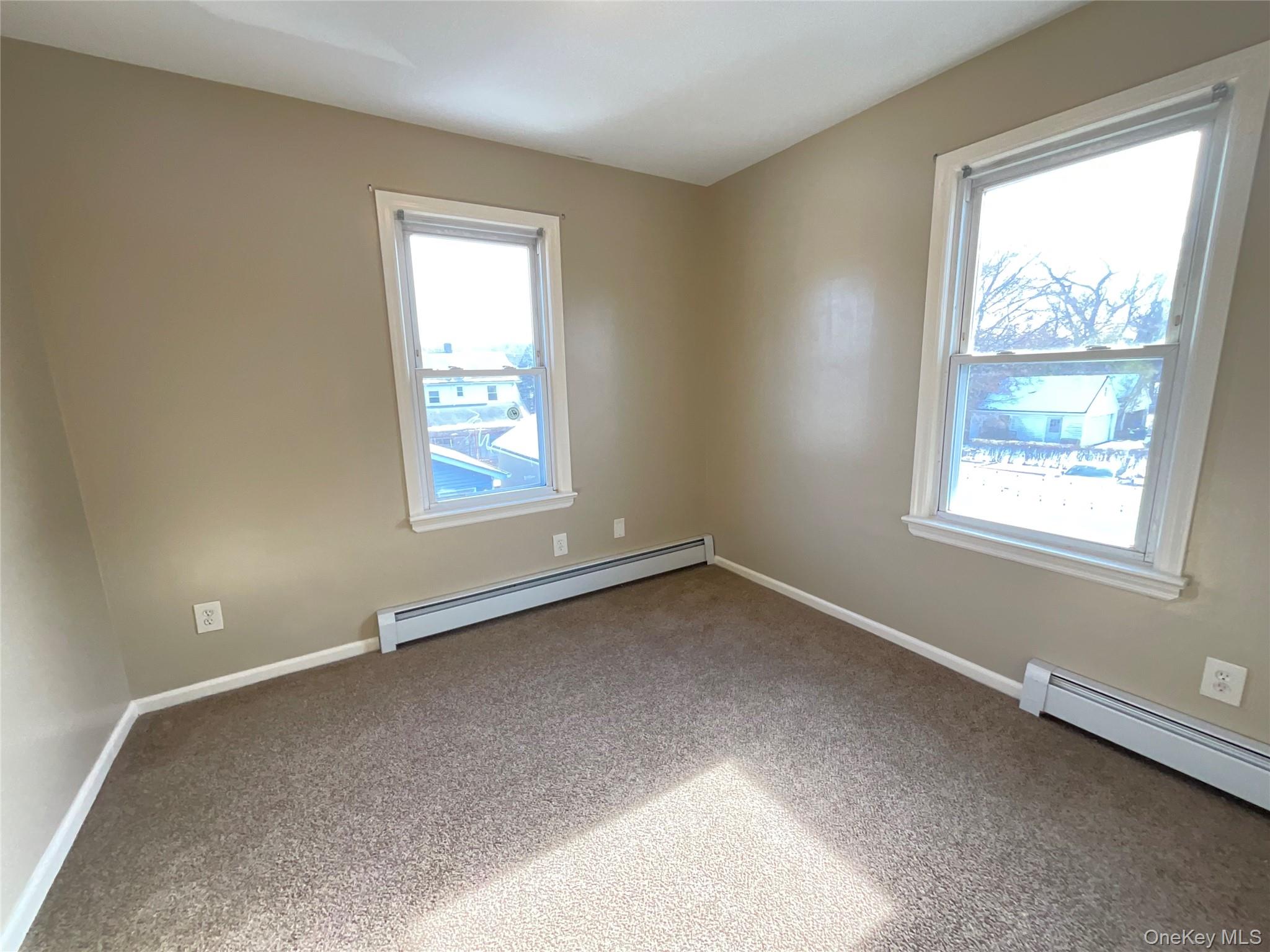 32 Prairie Avenue, Unit B Suffern, NY 10901 - Photo 24 of 26 an empty room with windows