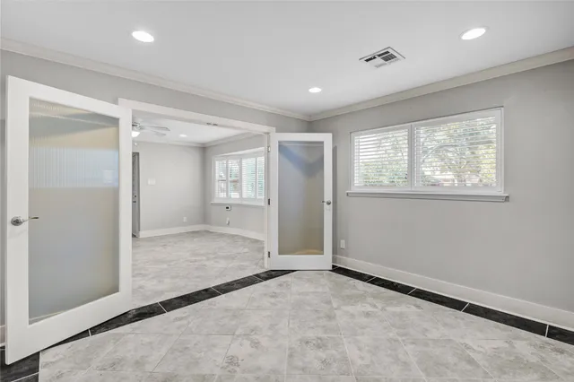 a bathroom with a granite countertop sink a mirror and a shower